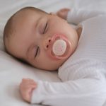 Baby Girl Sleeping With Pacifier on Her Mouth