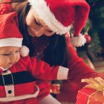 Mother and baby with Christmas present