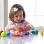 Girl playing with play dough