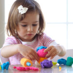 Girl playing with play dough